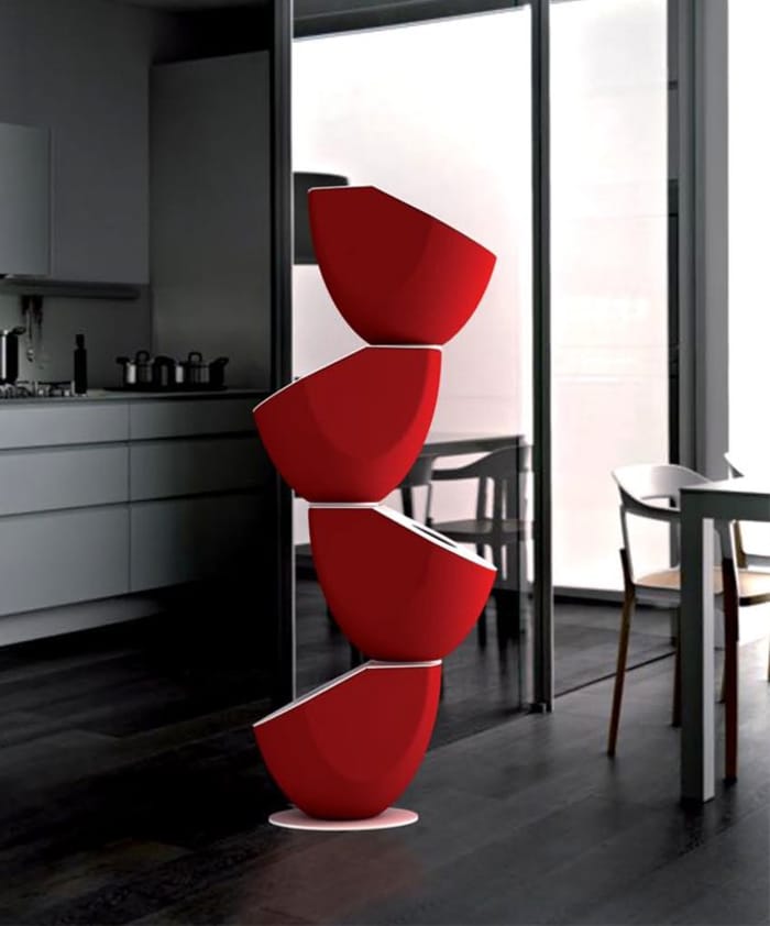 A modern sculpture, made of 4 bins stacked on top of each other.