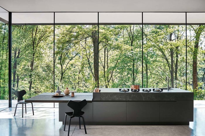 Modern kitchen with view to the outdoors, great example of biophilic design. Modern kitchen with view to the outdoors, great example of biophilic design.<span class="sr-only"> (opened in a new window/tab)</span>