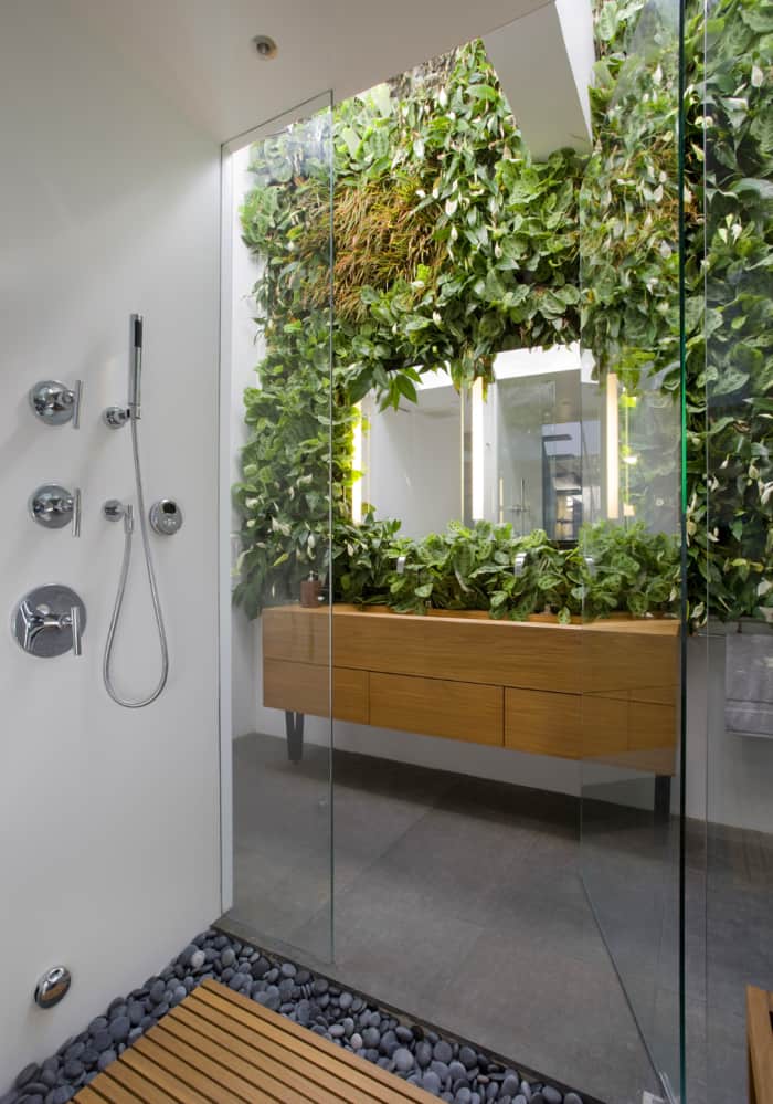 Modern bathroom with a garden wall design all around the vanity wall. Modern bathroom with a garden wall design all around the vanity wall.<span class="sr-only"> (opened in a new window/tab)</span>
