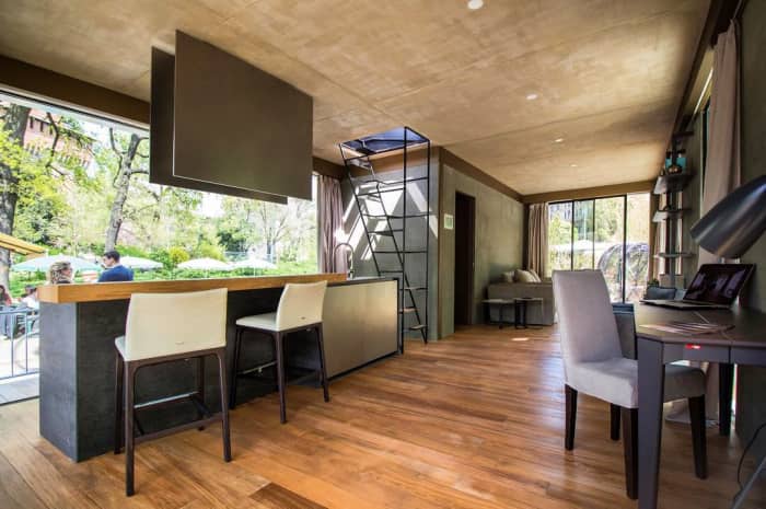 The interior of Genesi House, an example of sustainable living and energy efficiency. View of the kitchen and dining areas. The interior of Genesi House, an example of sustainable living and energy efficiency. View of the kitchen and dining areas.<span class="sr-only"> (opened in a new window/tab)</span>