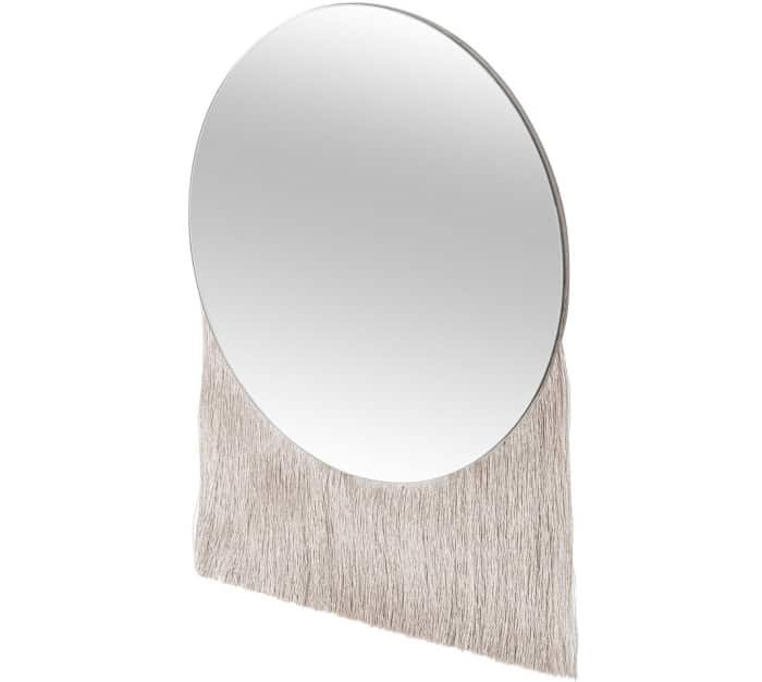 Round mirror with fringe falling from the bottom, by Oliver Bonas.