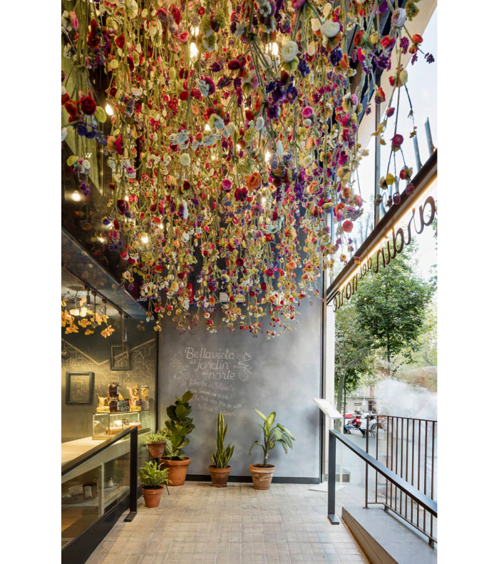 Restaurant entrance with thousands of colourful tulips hanging from the ceiling.