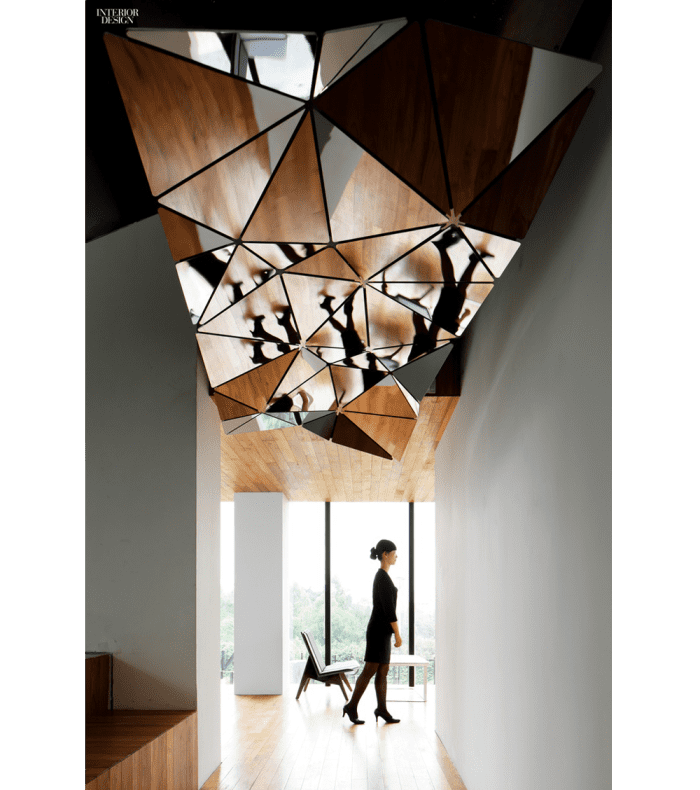 Corridor with faceted mirror ceiling.