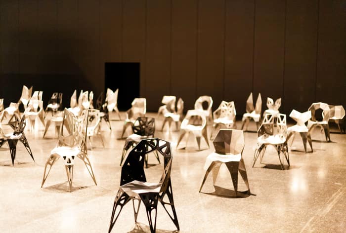The fifty chairs displayed at the entrance of the fair The fifty chairs displayed at the entrance of the fair