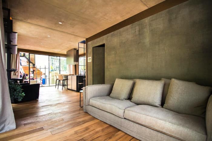 The interior of Genesi House, an example of sustainable living and energy efficiency. View of the entrance and flexible living/sleeping area. The interior of Genesi House, an example of sustainable living and energy efficiency. View of the entrance and flexible living/sleeping area.