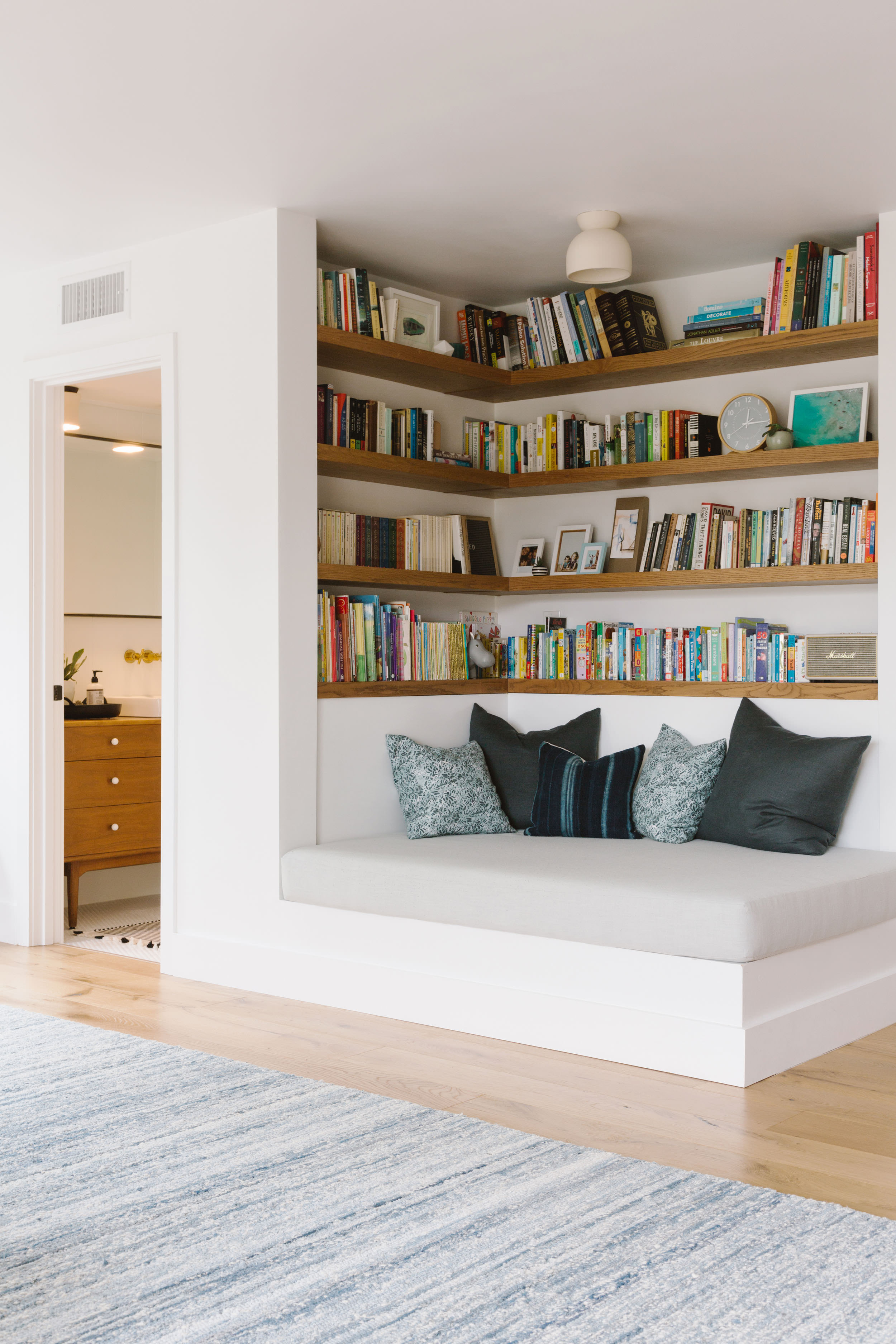 Reading nook in a modern living room, great option to create a refuge area in a biophilic design.