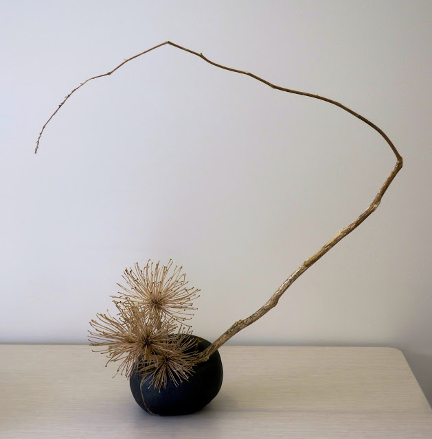 Ikebana arrangement of dried branches, perfect décor in a minimalist interior.