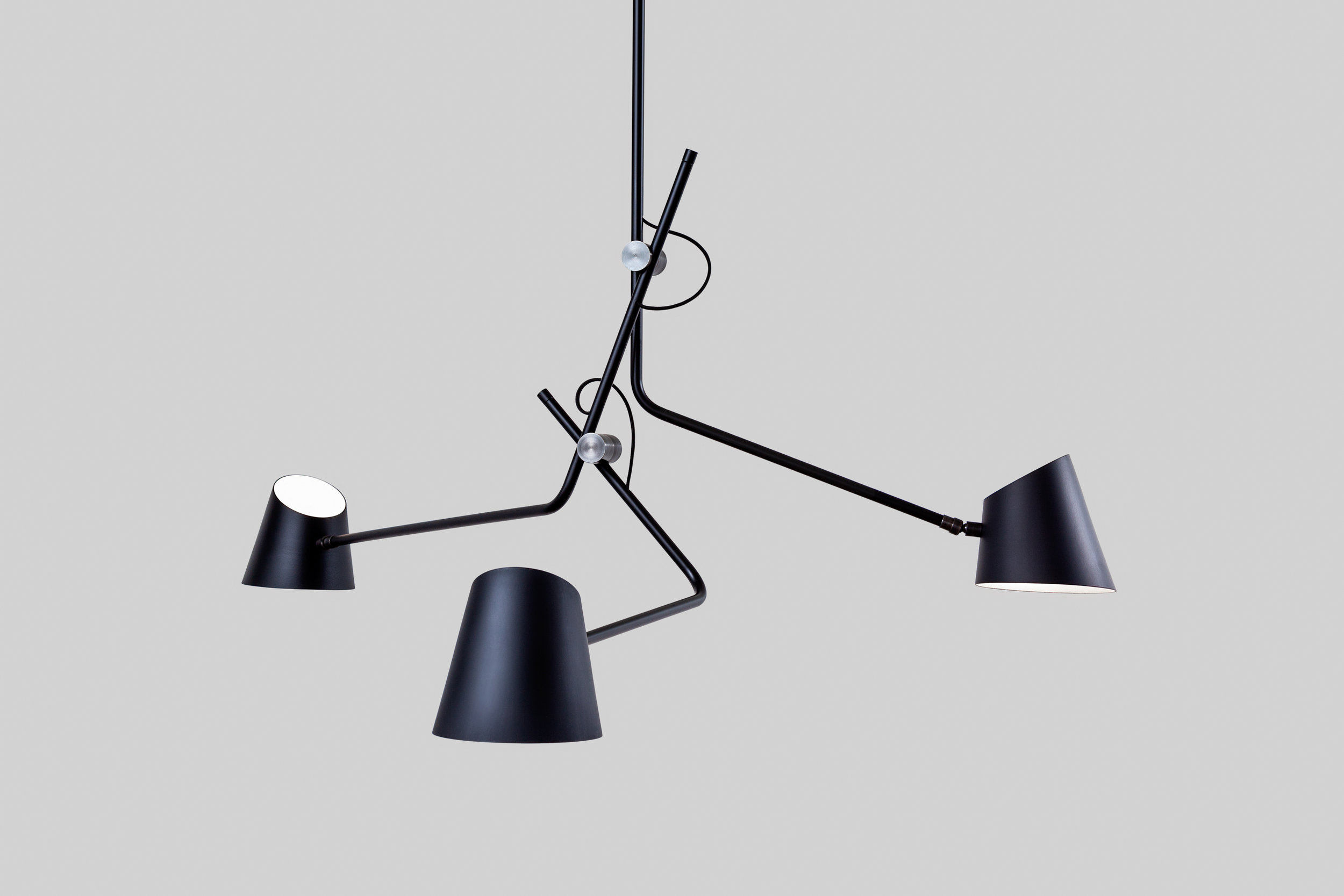 Sculptural pendant lamp with three arms.