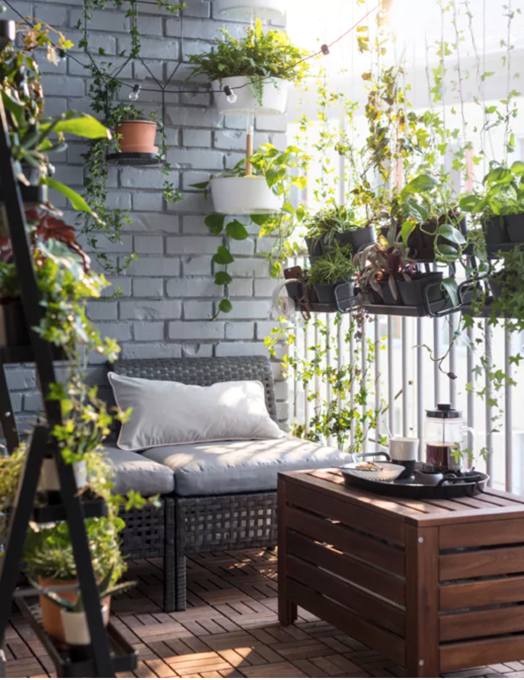 Balcony with greenery all around.
