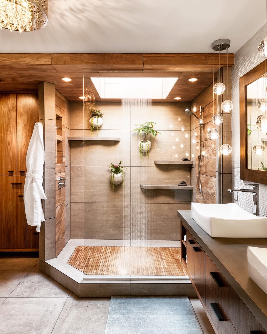 Natural bathroom design with plants hang on the wall into the shower.