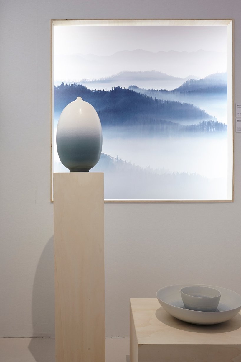 A blue foggy landscape artwork and two sculptural vases exposed at the Maison et Objet's exhibition on silence.