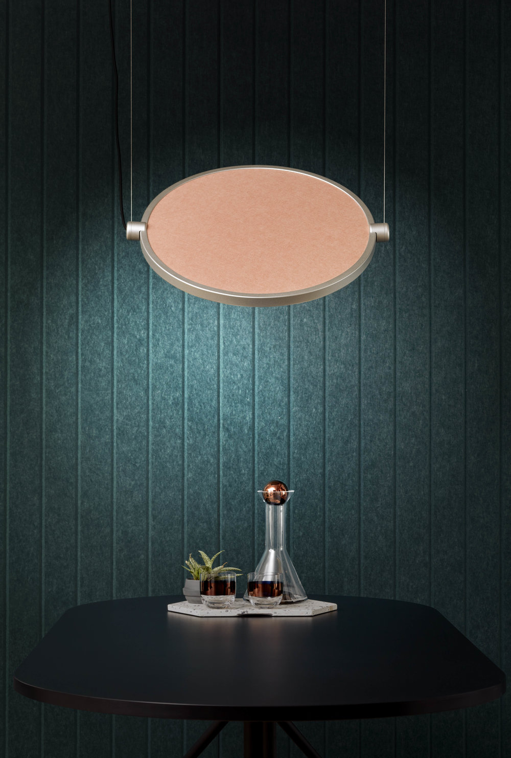 An acoustic panel used as a decorative wall finish. With its teal colour and striped texture it substitutes a wallpaper perfectly.
