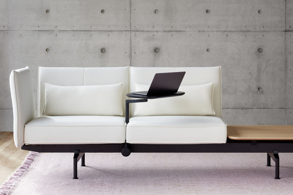 Sofa with integrated small desk.