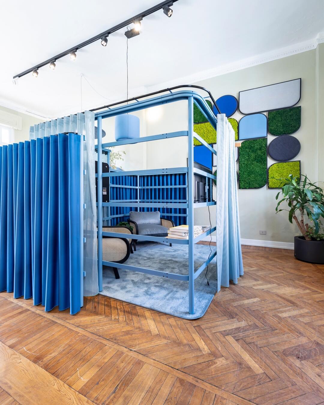 Small conversation areas enclosed with curtains.