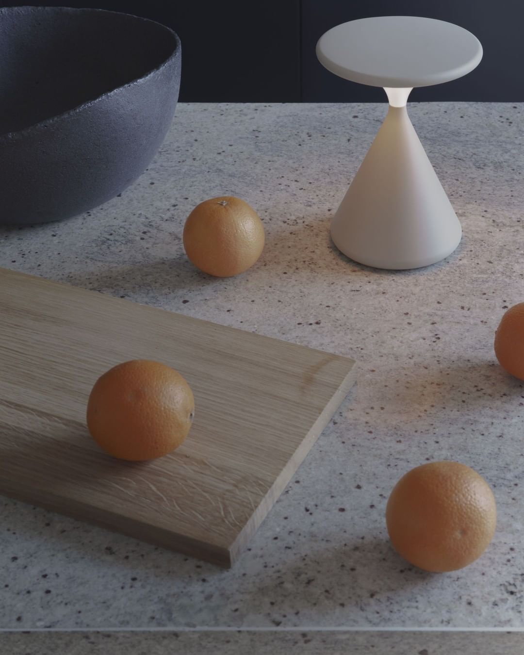 Portable table lamp on a kitchen countertop.