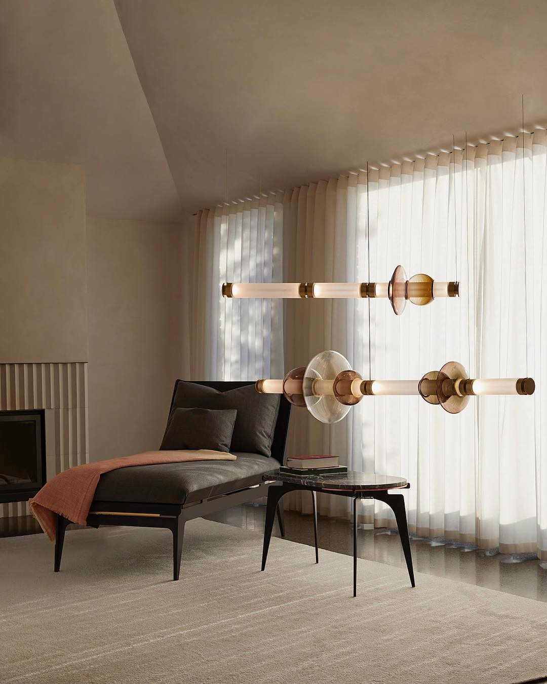 Modular pendant light made of individual blown-glass tubes.