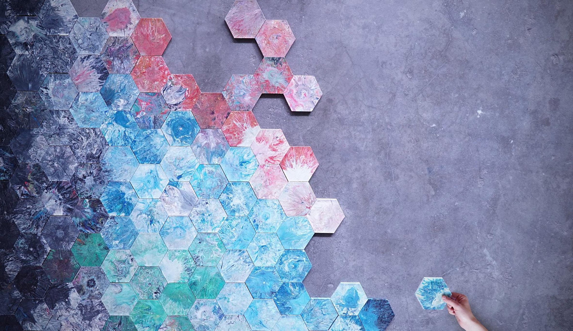 A wall of hexagonal recycled plastic tiles.
