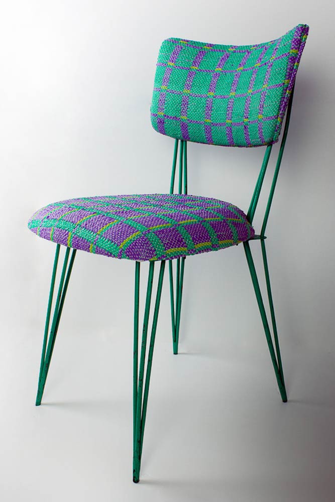 Metal chair with seat upholstered with Plastex, a sustainable material made recycling plastic bags.