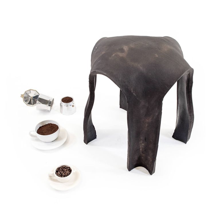 Circular stool made out of coffee grounds.