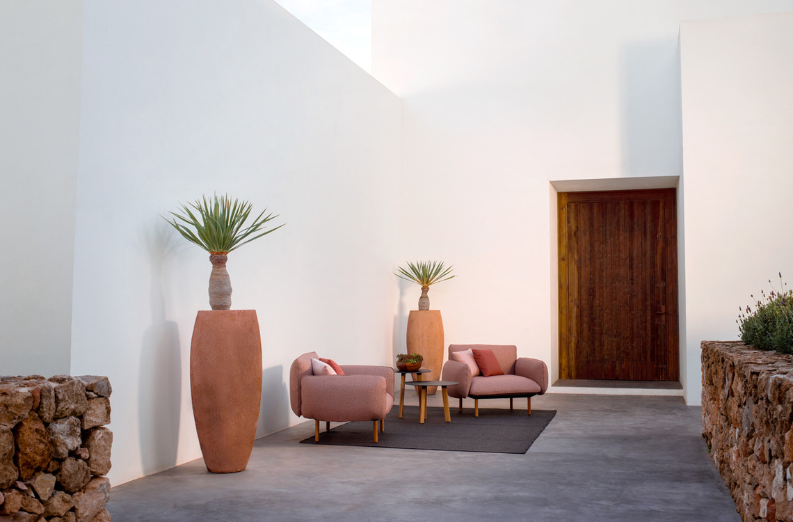 Upholstered outdoor chairs with a soft look.