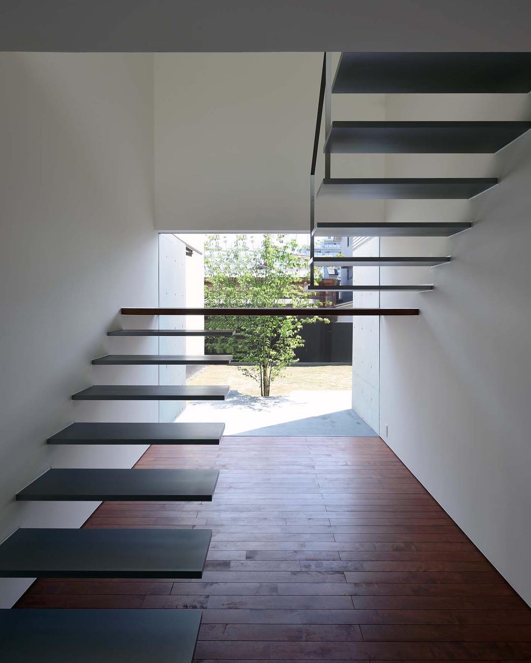 A floating staircase with no railing.