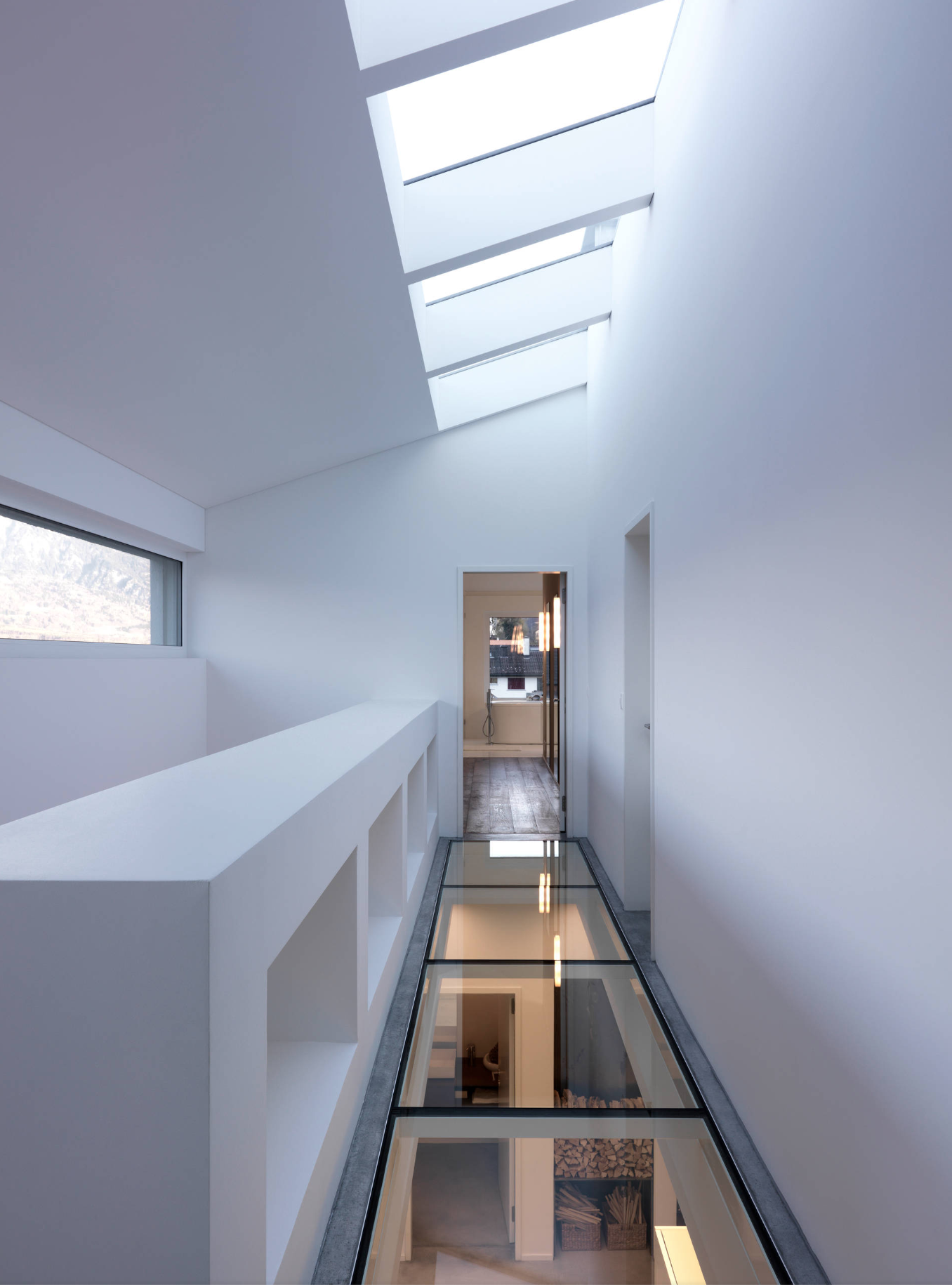 A corridor with clear glass flooring.