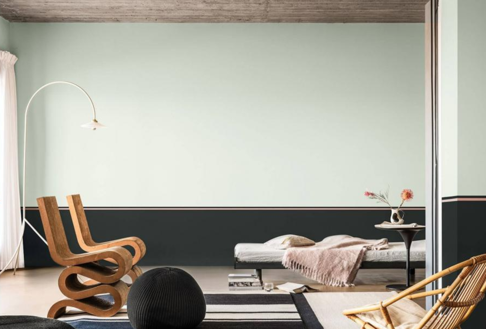 Biophilic living room with Tranquil Dawn and charcoal striped walls and minimal furniture.