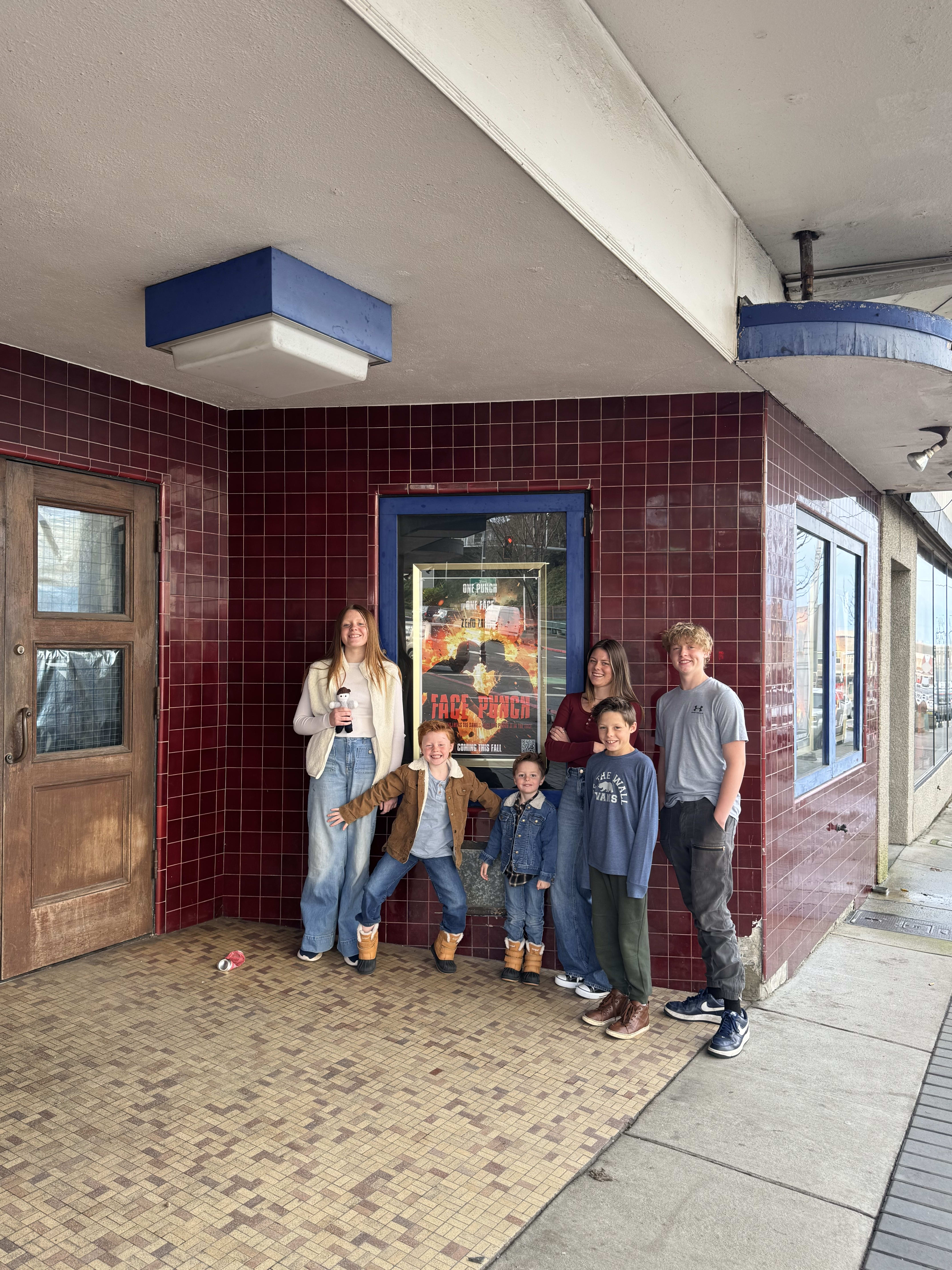 Six kids posing in front of a historic movie theater in downtown Port Angeles, Washington