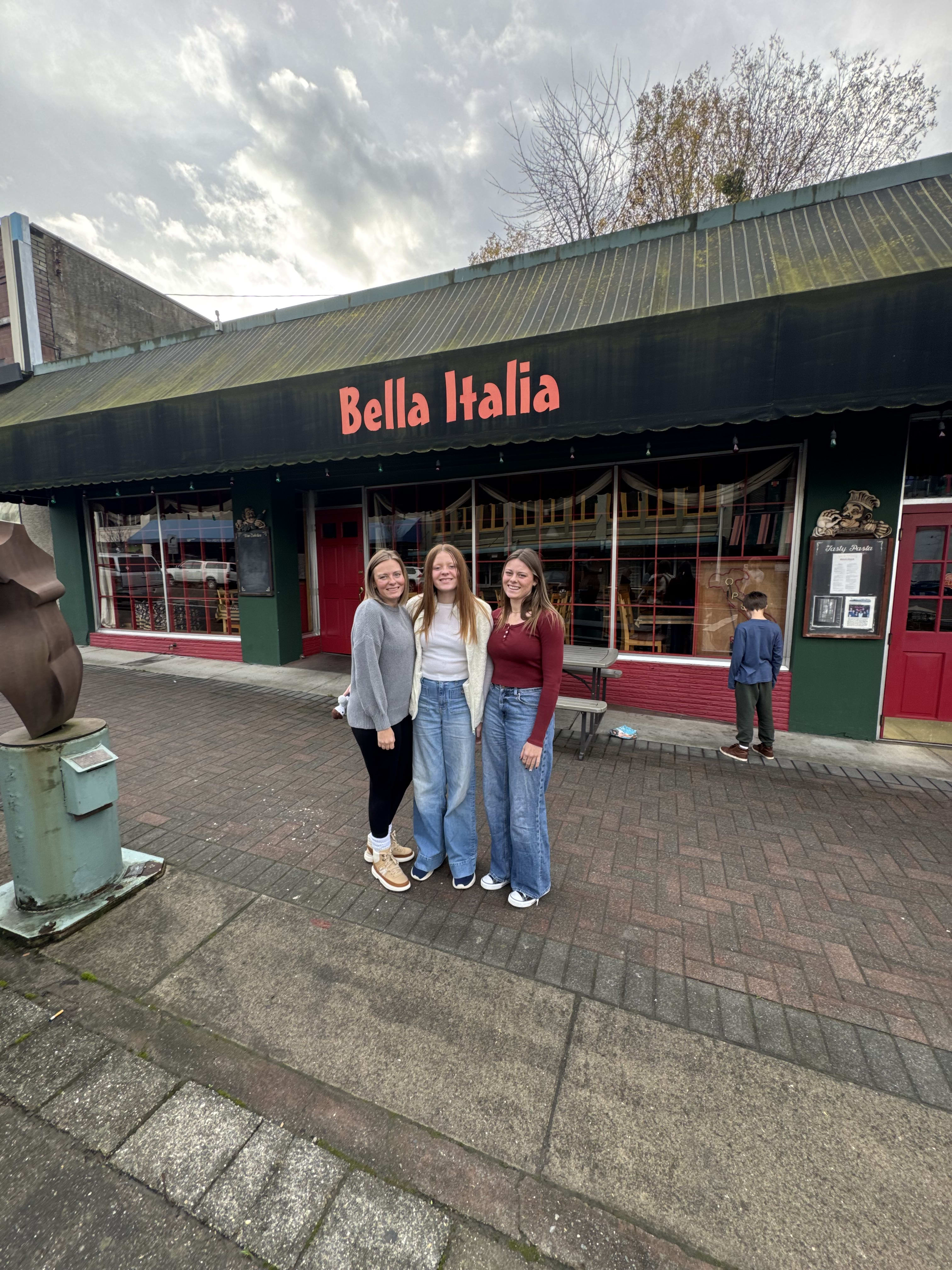 Family standing outside Bella Italia, the Twilight restaurant in Port Angeles, Washington