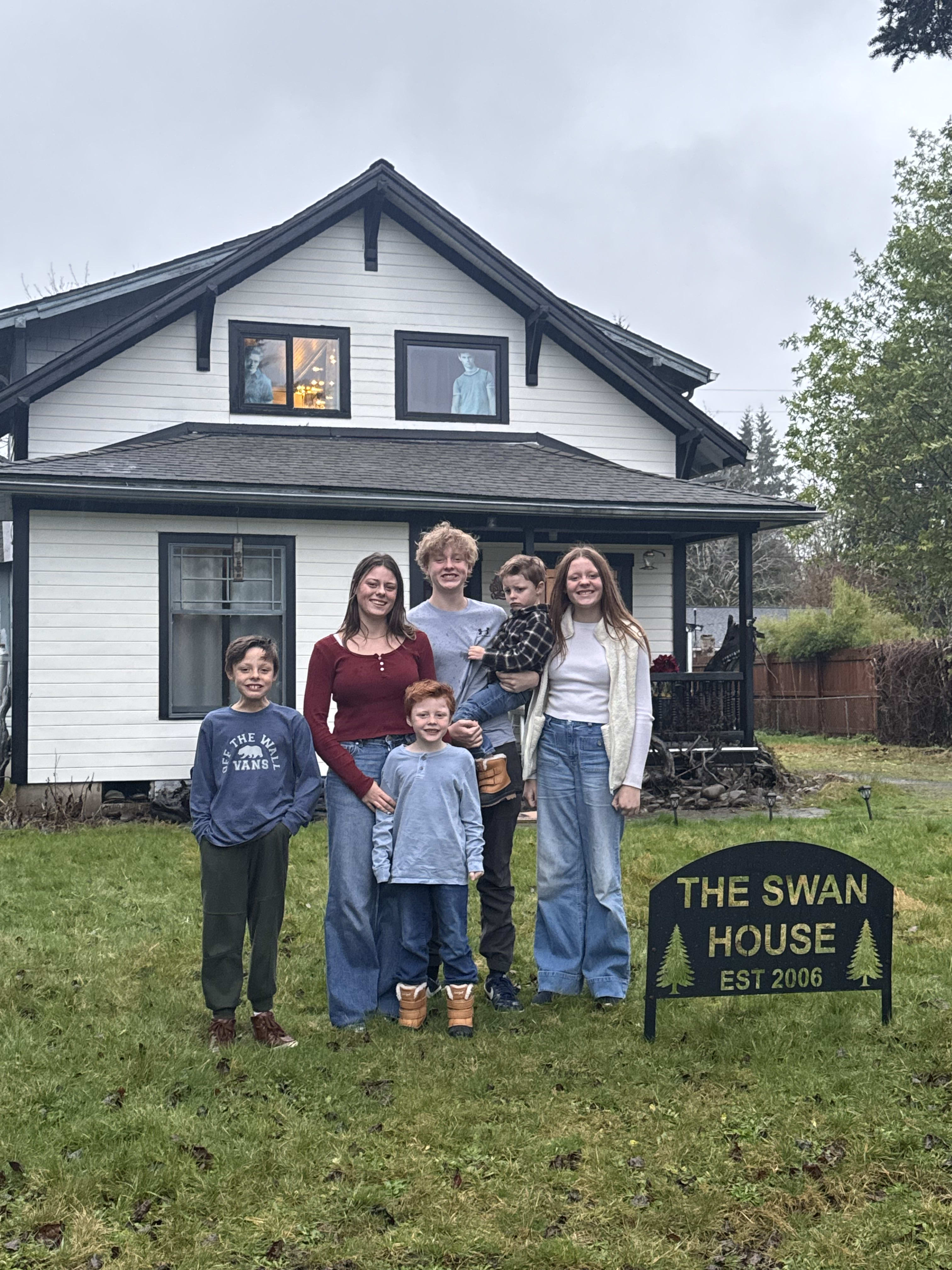 Family in front of the Swan House in Forks, Washington