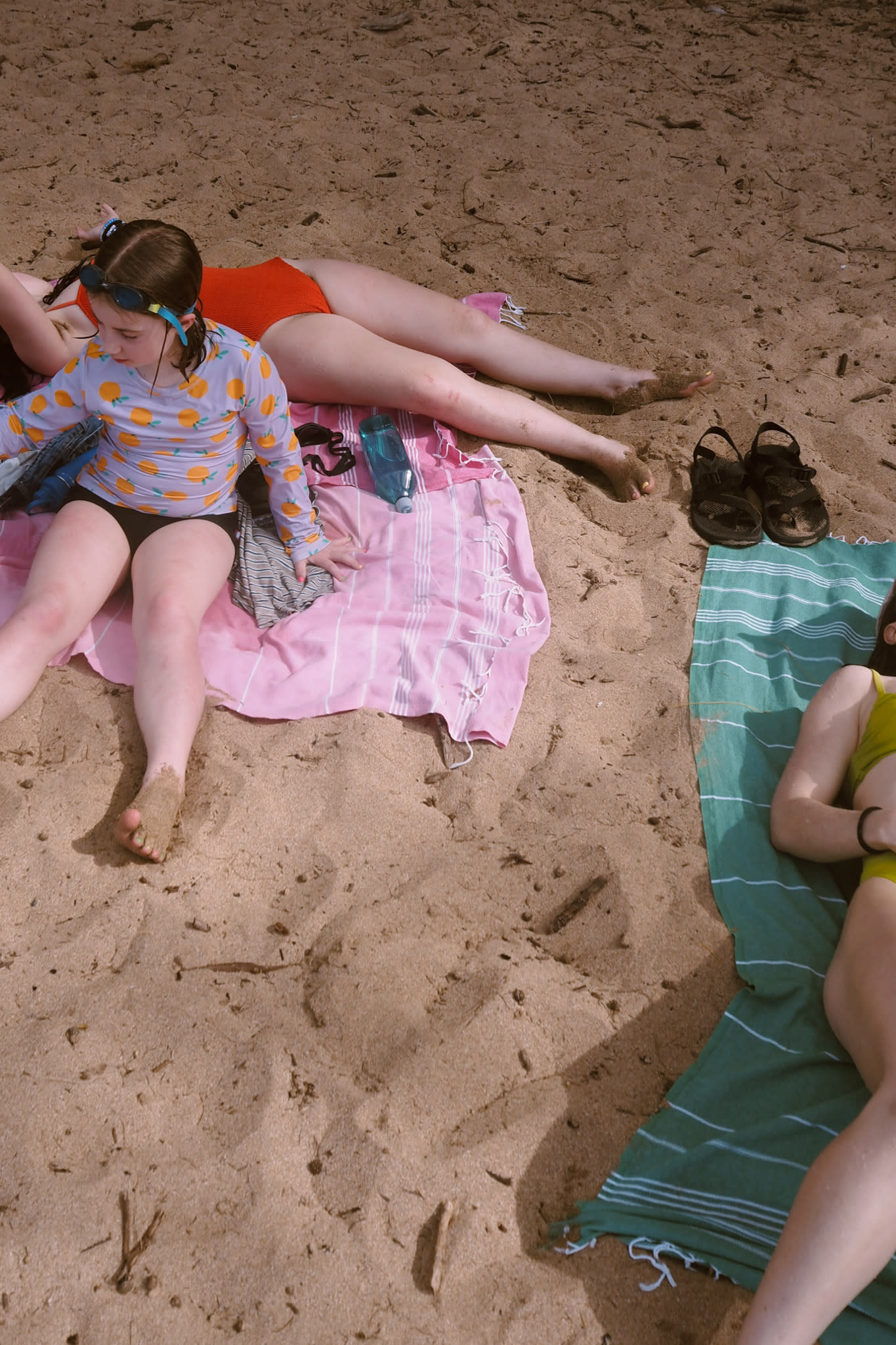 A family relaxing on the beach in maui
