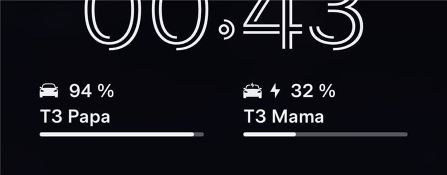 Two Teslas on a lock screen widget, one charging with a bolt icon and both with clear SOC bars