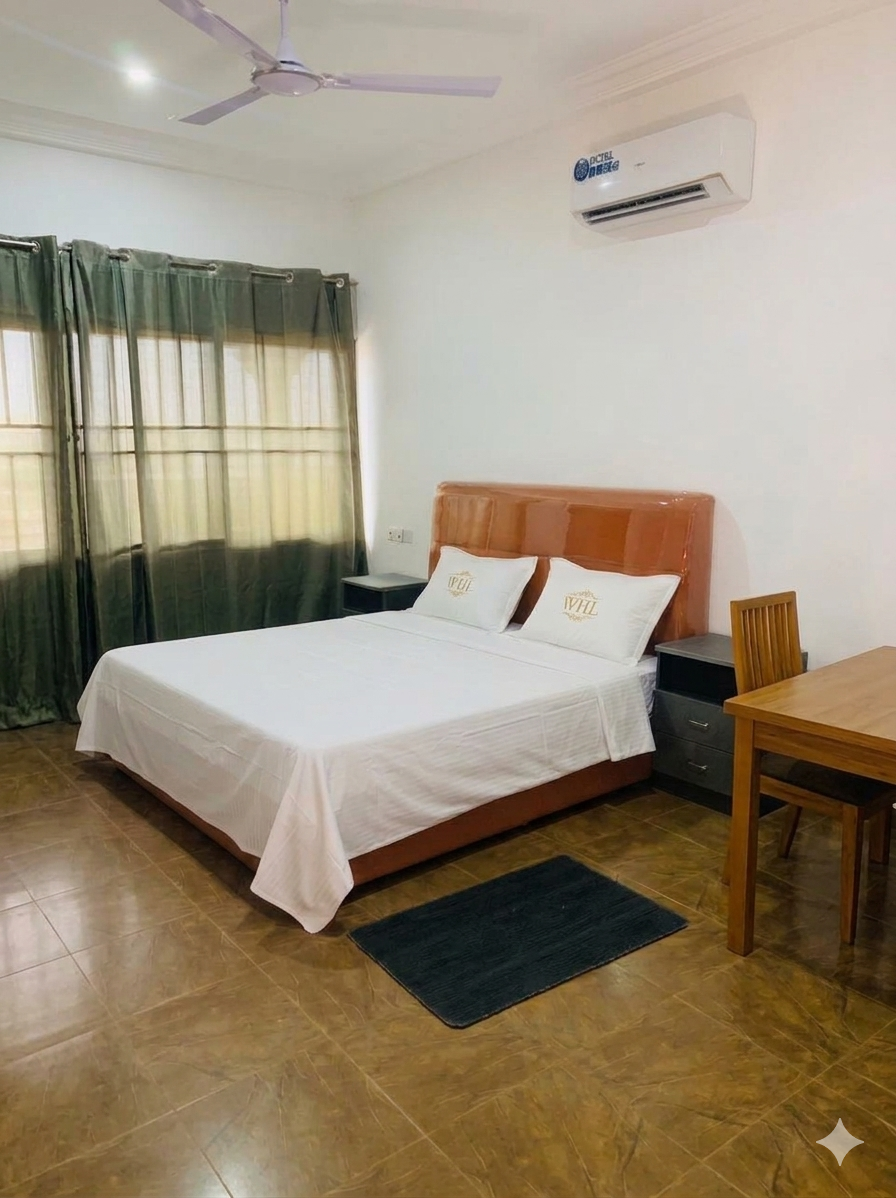 Bright guest room with crisp bedding and warm lighting