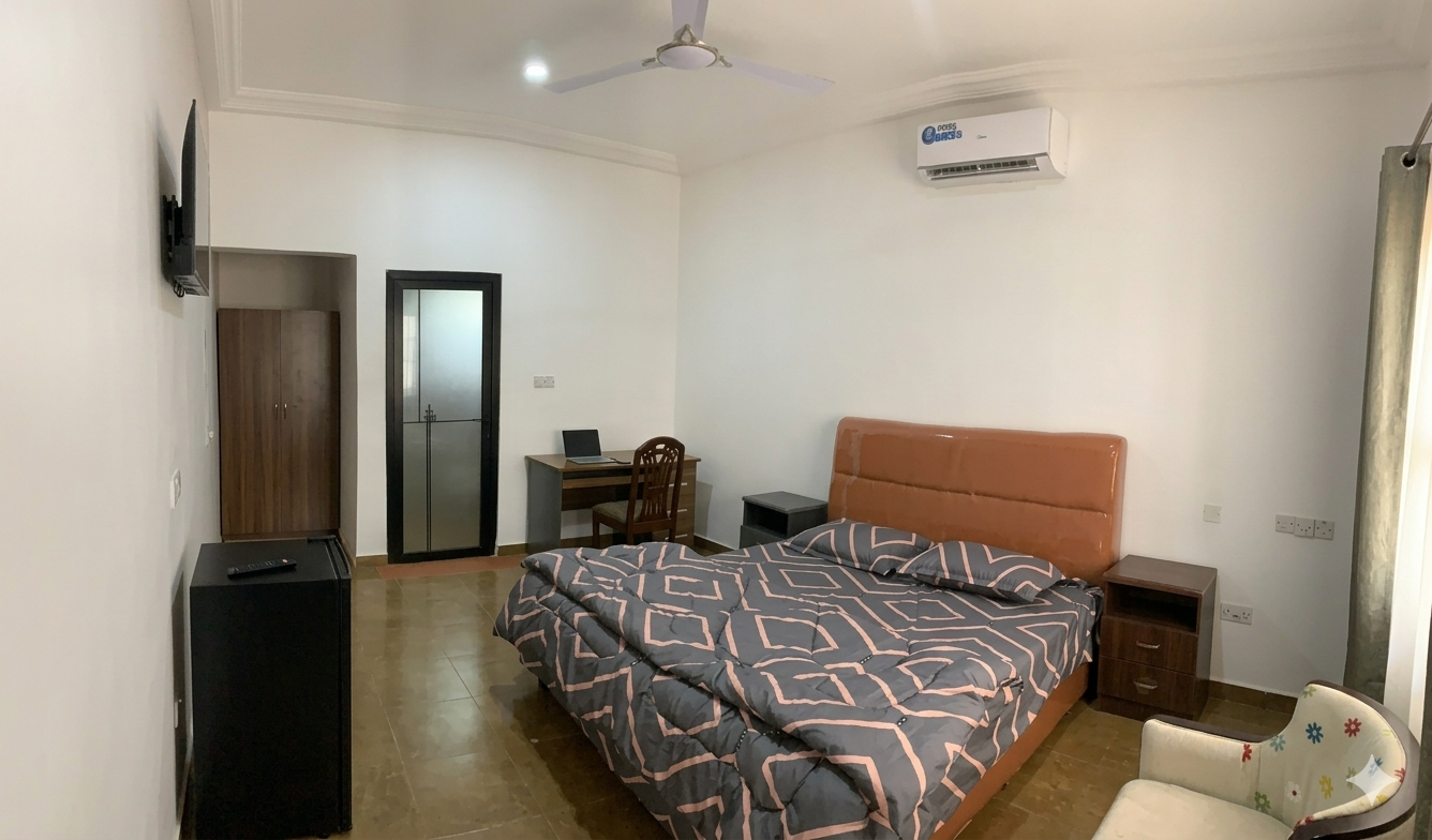 Modern hotel room with desk and city view