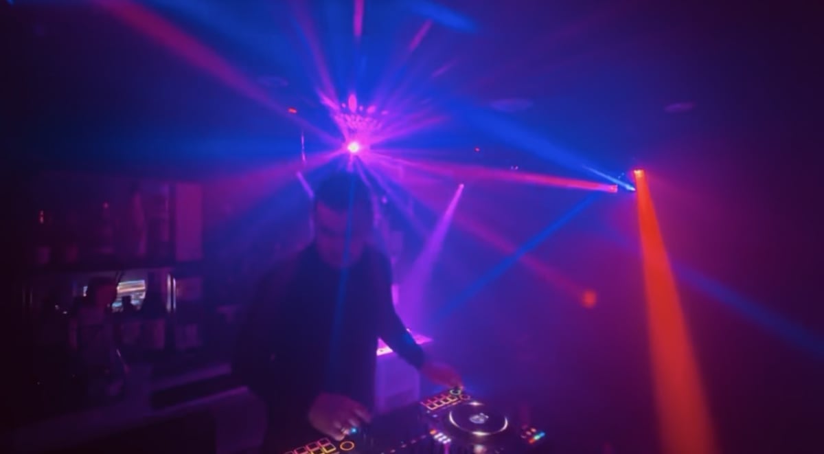 DFRACTD DJ booth and dancefloor during a live set