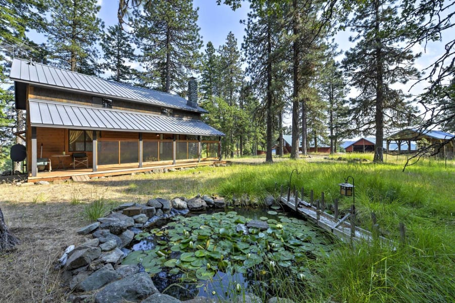 The Sanctuary Cabin above its lily pond