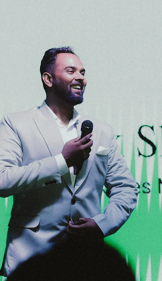 A Plaxonic leader speaking at a company event