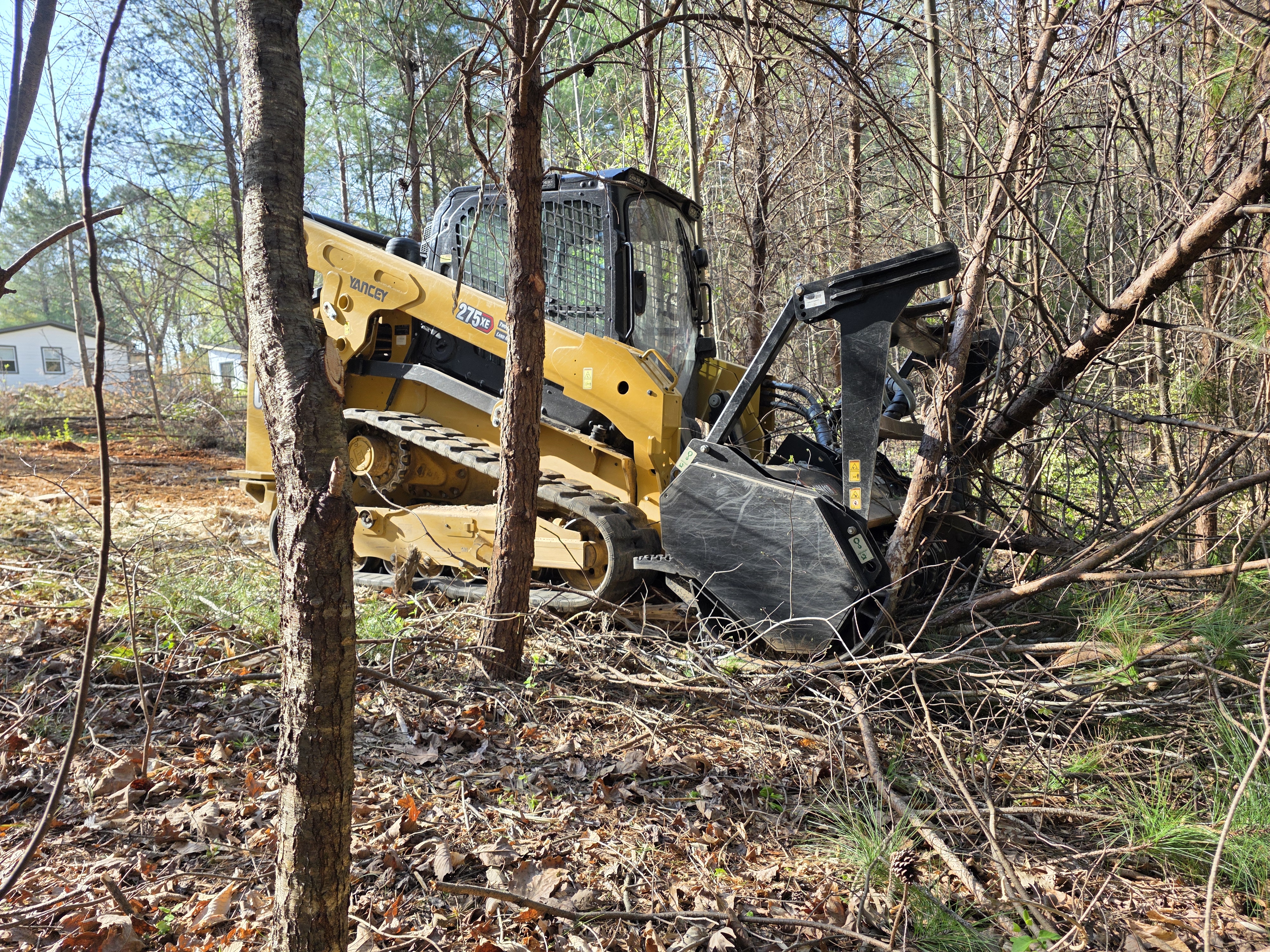 Forestry mulching machine clearing brush