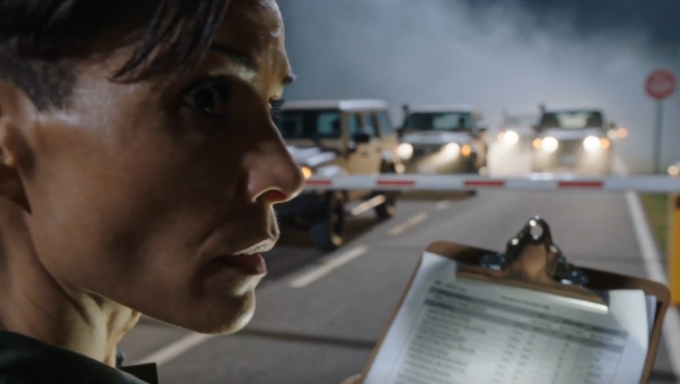 Jessica Lincdelis at a checkpoint, convoy approaching