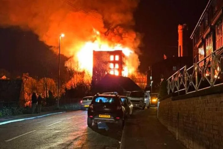 Flames light up sky after fire rips through historic Grade II building
