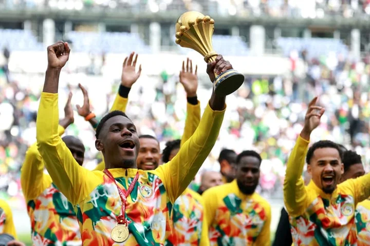 Defiant Senegal parade AFCON trophy despite being stripped of title