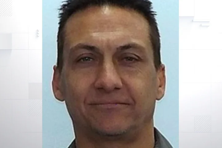 Fugitive accused of killing two police officers 'shot dead'