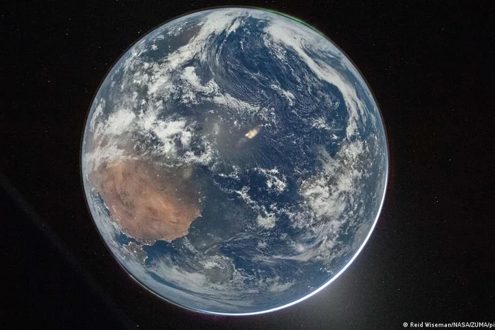 Artemis II passes halfway point to moon, sends Earth photos