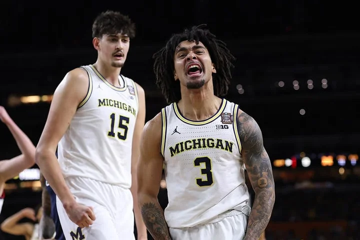 Michigan holds off UConn to capture first men's basketball national title since 1989