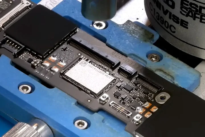 Don't like the MacBook Neo's storage options? Well, with lots of electronics gear, years of experience, and nerves of steel, you too can have a 1 TB model