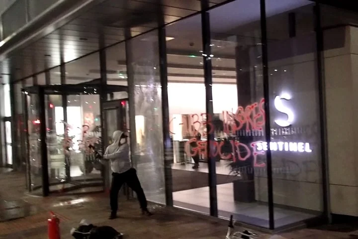 Palestine activists vandalising Glasgow insurance office