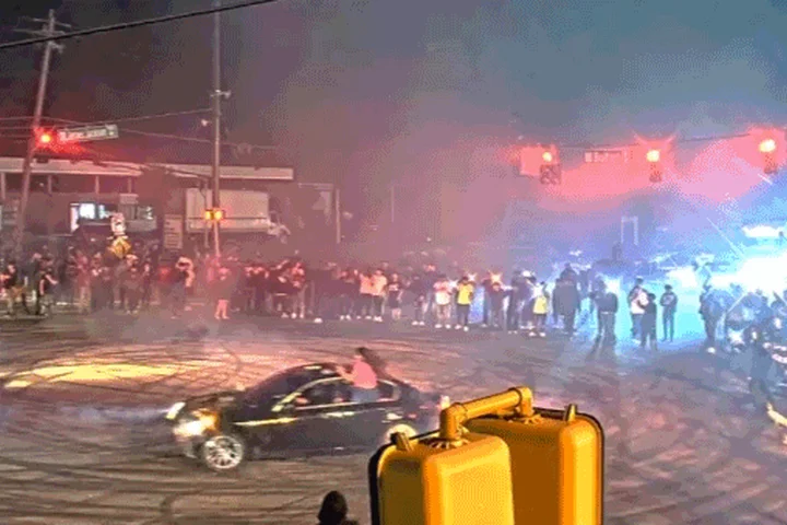 WATCH: Illegal street racing 'takeover' explodes as hundreds swarm streets and suspects bolt