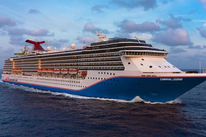 Cruise passengers witness terrifying rescue at sea as stranded man and cat pulled from failing sailboat