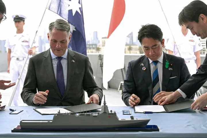 Australia and Japan sign contracts for $7bn warships deal
