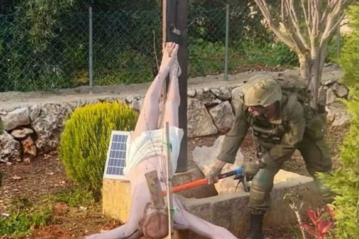 Outrage as IDF soldier pictured smashing statue of Jesus with an axe in south Lebanon